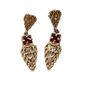 Gold tone dangle pierced earrings red gemstone